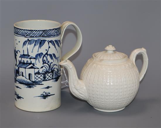 A late 18th century pearlware blue and white Chinese landscape mug, and a Wedgwood type white stoneware teapot and cover mug height 1